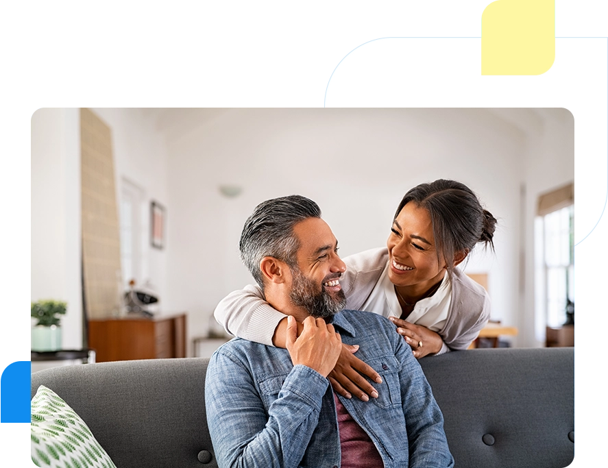 A man and woman are sitting on the couch.